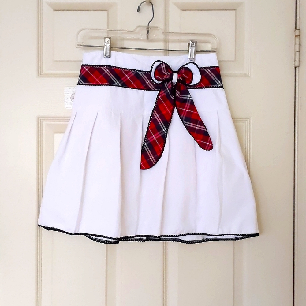 NWOT. Cotton Skirt w/full lining, lace edge and multi color plaid bow tie/decor.